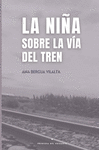 LA NIA SOBRE LA VIA DEL TREN